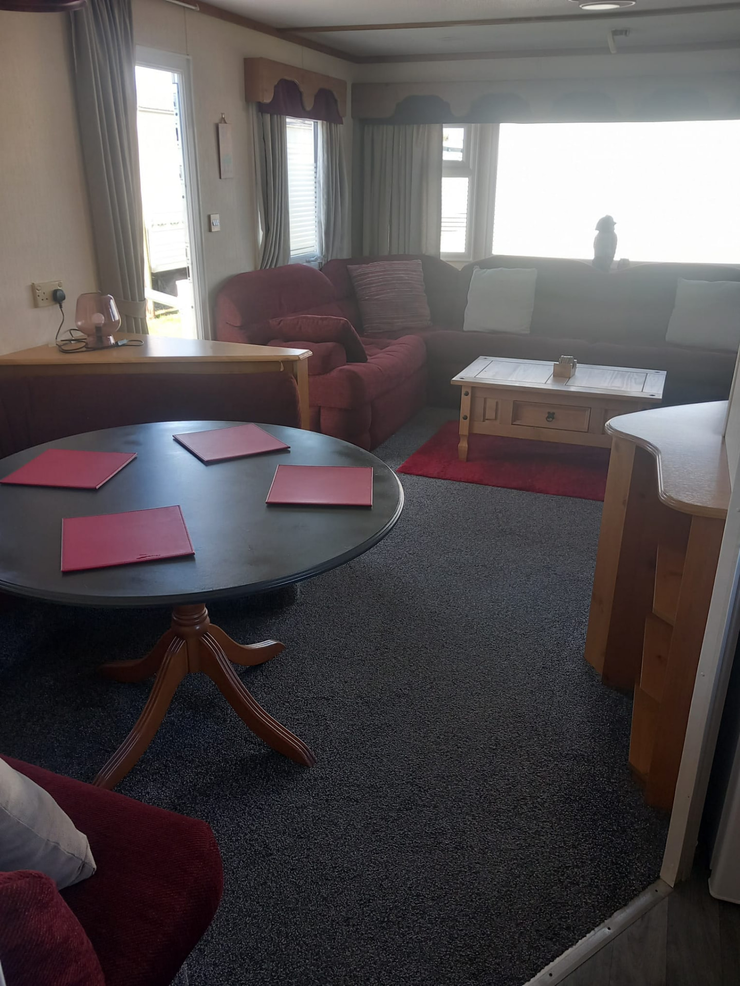 Dining area leading through to the lounge inside caravan C40