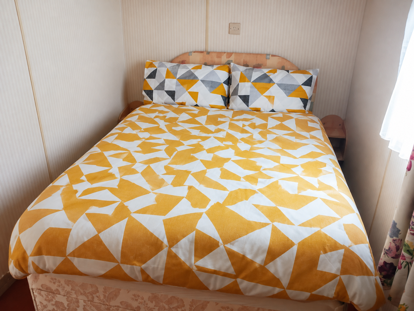 Double bedroom inside holiday caravan C23 at Kings Caravan Park