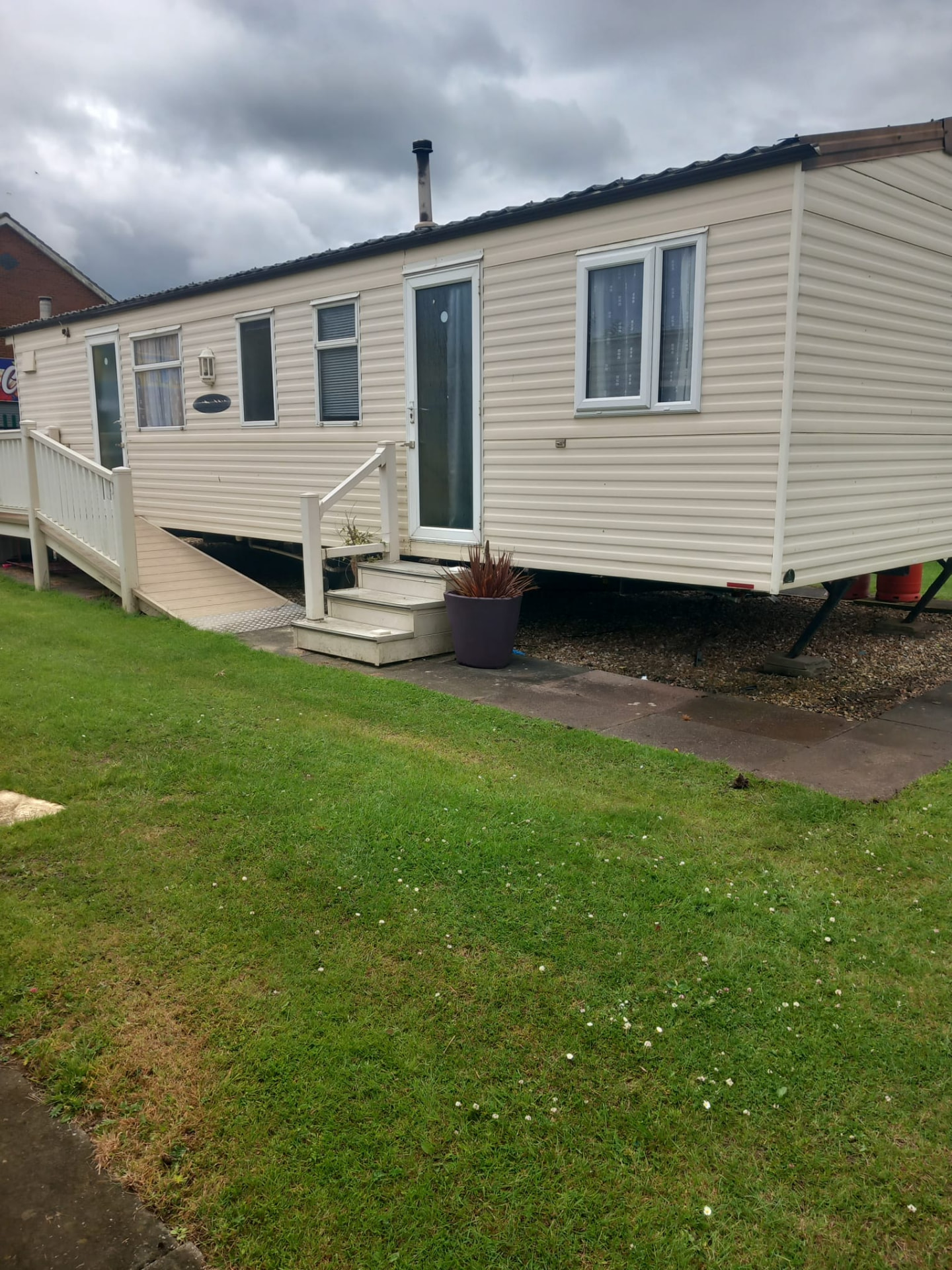 Side view of caravan 370 showing the ramped decking access