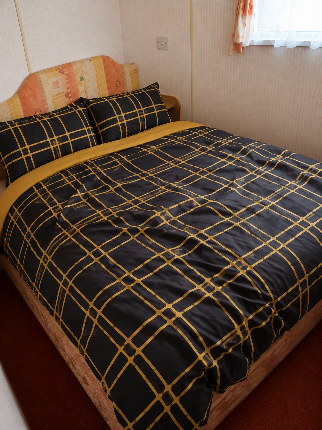 Double bedroom inside holiday caravan A13 at Kings Caravan Park